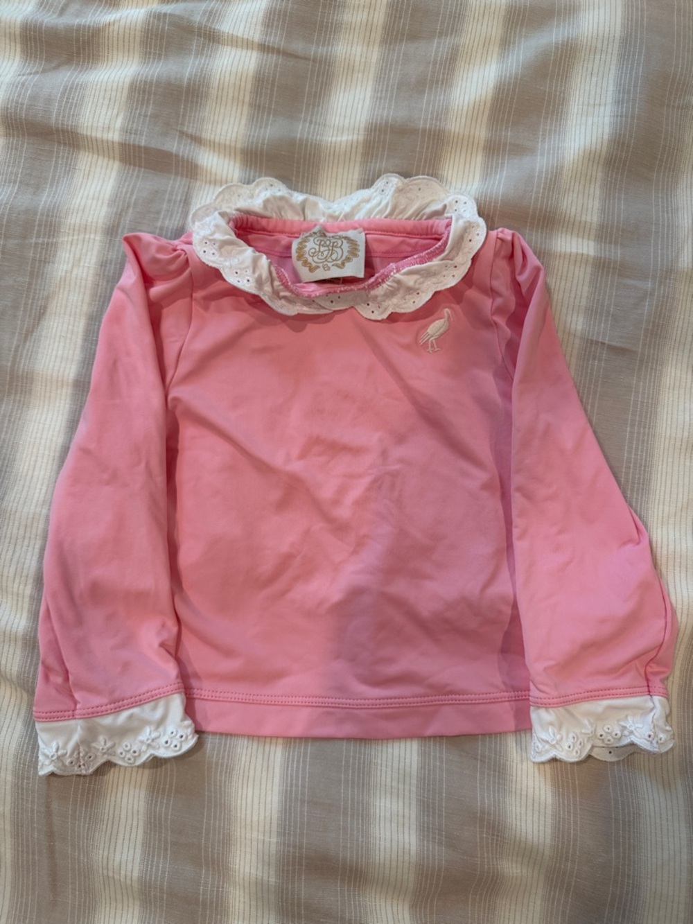 The Beaufort Bonnet Company girl’s pink rashguard swim shirt